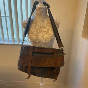 Navy blue and brown leather messenger bag